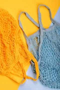 Yellow and blue string reusable bags Stock Photos