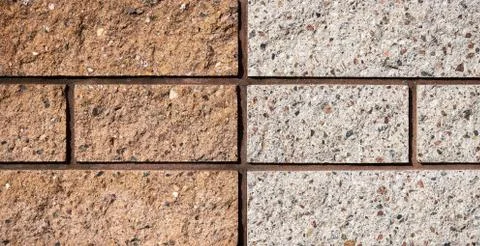 Yellow and gray bricks wall. Bricks texure. Brick background Stock Photos