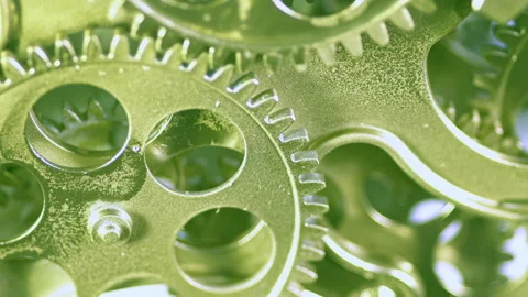 Yellow and Green Metallic Colored Gear Wheels Spinning Stock Footage 288633740