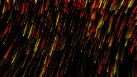 Yellow and red glittering particles fall from corner to corner against a black Stock Footage 153137969