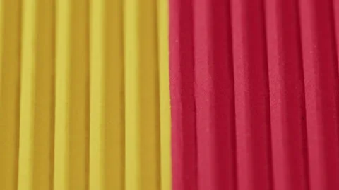 Yellow and red ribbed paper close-up. Macro shooting of cardboard textured Stock Footage 169237283