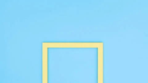 Yellow and two white frames appear on blue theme. Stop motion Stock Footage 138184532
