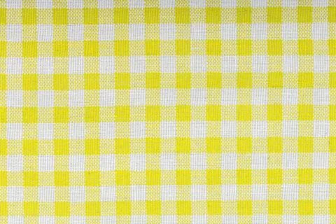 Yellow and white checkered, pattern, design, cotton fabric for sewing, textur Stock Photos