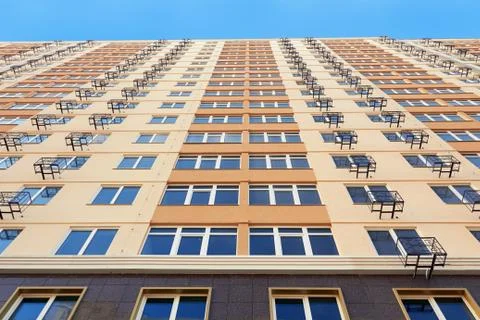 Yellow apartment building Stock Photos