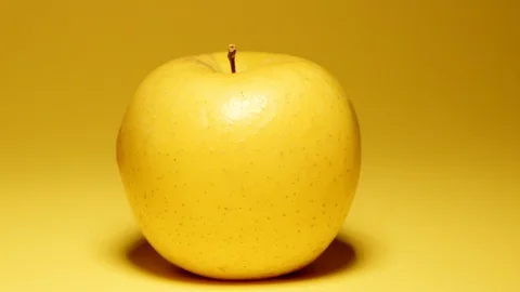Yellow apple over yellow background Stock Footage 119108163