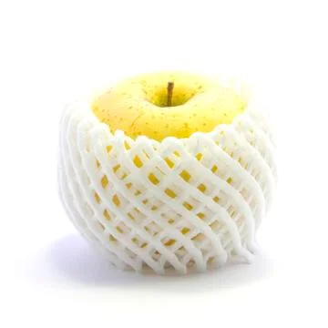 Yellow apple in shockproof nets on white background Stock Photos