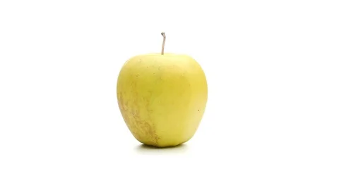 Yellow apple on white background rotating 360 degrees 4k Stock Footage 105929898