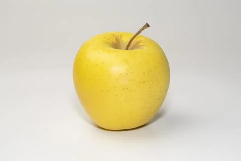 Yellow apple on a white background side view Stock-Fotos