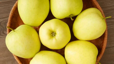 Yellow apples in a basket. Video stock 247391732