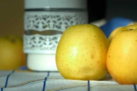 Yellow apples in the kitchen Stock Photos