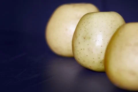 Yellow apples in a row Stock Photos