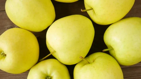 Yellow apples on the table. Video stock 245681757