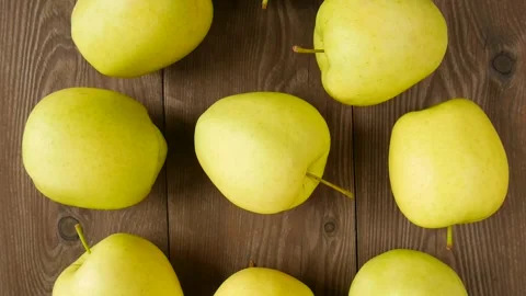 Yellow apples on the table. Video stock 247607833