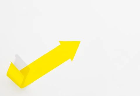 Yellow arrow pointing right upper corner 스톡 사진