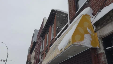 Yellow Awning Sagging Under Snow, Brooklyn Commercial Street, Blizzard 動画素材 329888715