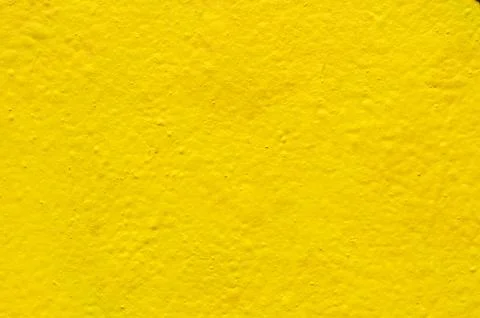 Yellow background on the cement wall Stock Photos