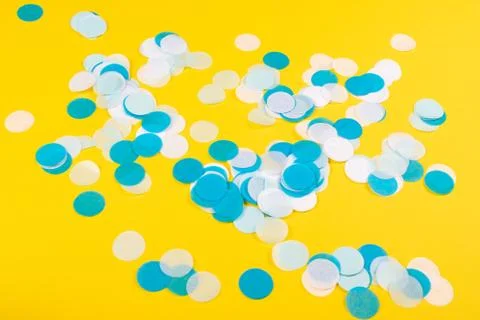 Yellow background with confetti. Stock Photos