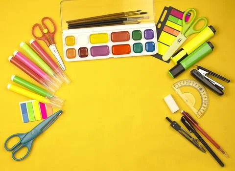Yellow background with copy space and end school items. Stock Photos