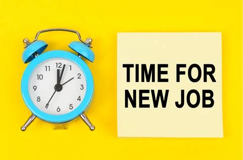 On a yellow background lie a clock and a sticker sheet with the inscription - Stock Photos