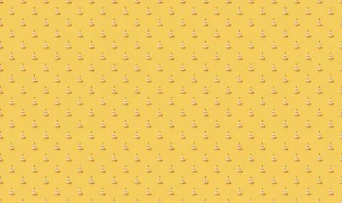 Yellow background with small white cupcakes pattern Stock Illustration