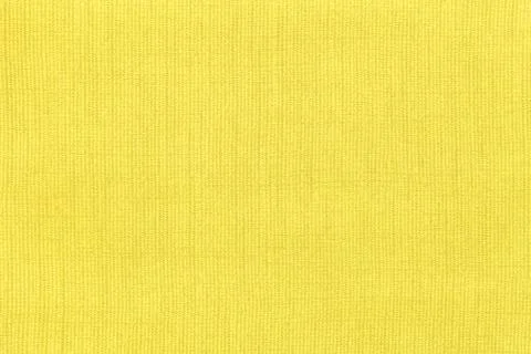 Yellow background from a textile material with pattern, closeup. Structure of Stock Photos