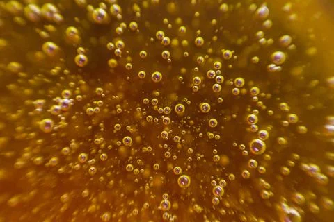 Yellow background, texture with bubbles in some liquid. Stock Photos