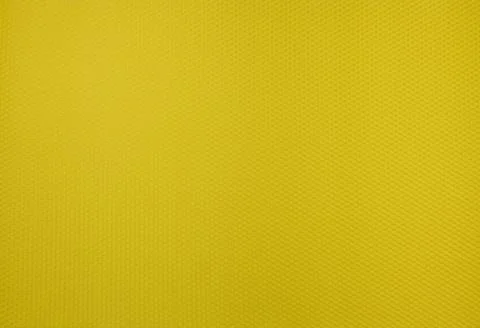 A yellow background texture made up of small hexagons that are slightly con.. Stock Photos