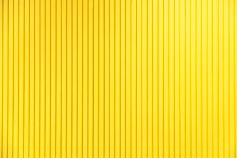 Yellow background texture pattern material and abstract wallpaper or wall yel Stock Photos