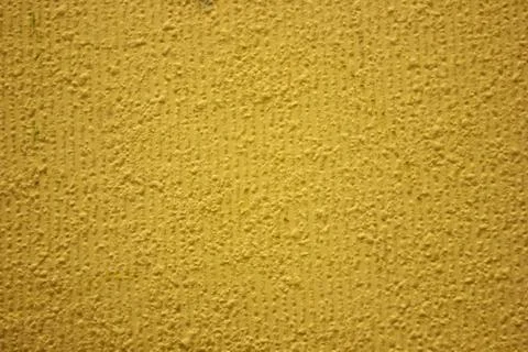 Yellow background texture.Facade plaster painted with yellow paint Stock-Fotos