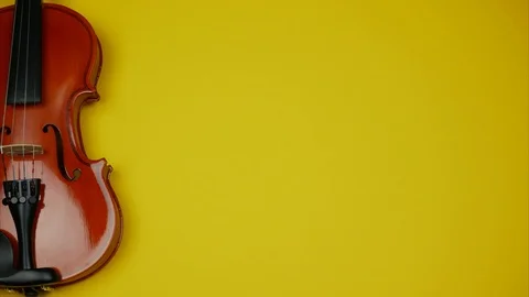 Yellow background with violin for a musical message. Stock Footage 99004941