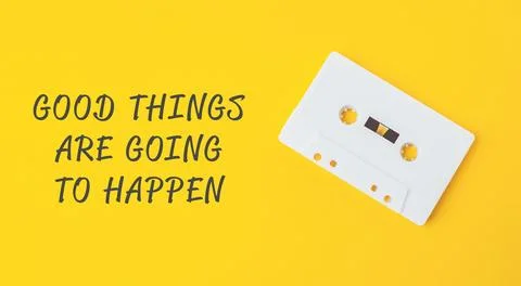 A yellow background with the words Good things are going to happen Stock Photos