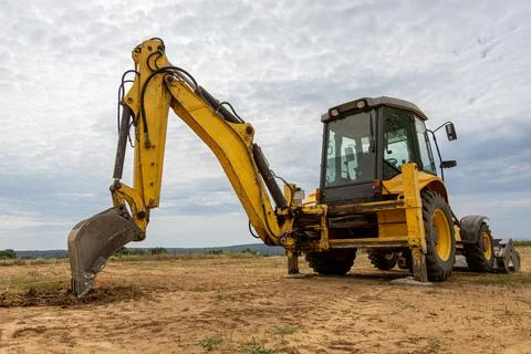 Yellow Backhoe Loader Excavator on Construction Site. Heavy Machinery for E.. Stock-Fotos