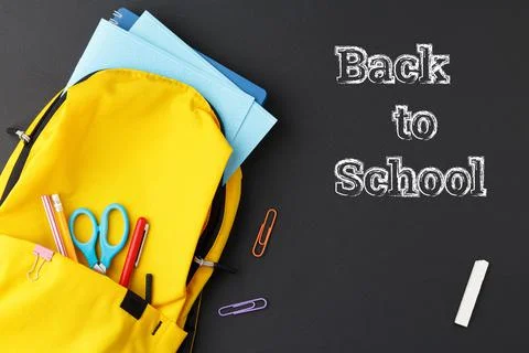 Yellow backpack collected for school. Stock Photos