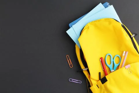 Yellow backpack collected for school. Foto stock