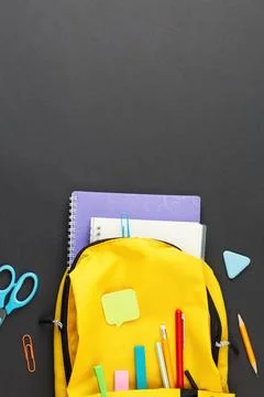 Yellow backpack collected for school. Foto stock