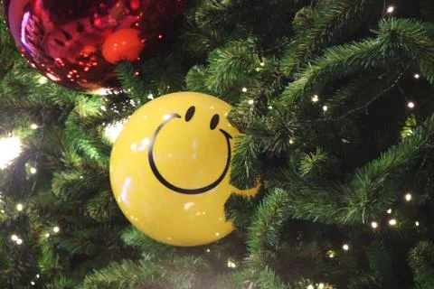 Yellow ball and artificial pine tree. Stock Photos