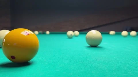 Yellow ball with red dot hits white ball with number 8 on green pool table Video stock 268349832