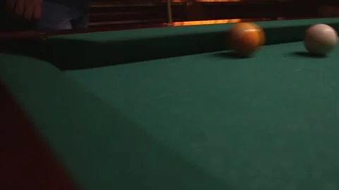 Yellow ball under flew into the pocket of the billiard table in the video Stock Footage 339029219