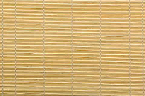 Yellow bamboo mat, background Stock Photos