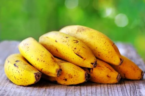 Yellow bananas on table Stock Photos