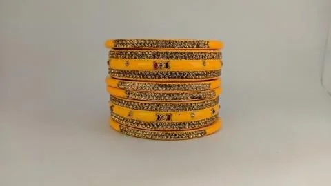 Yellow bangles isolated on white background - wedding / Traditional gold bang Stock Photos