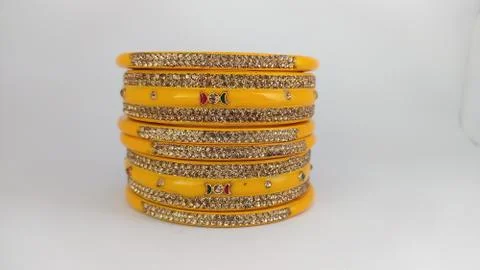 Yellow bangles isolated on white background - wedding / Traditional gold bang Stock Photos