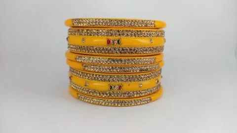 Yellow bangles isolated on white background - wedding / Traditional gold bang Stock Photos