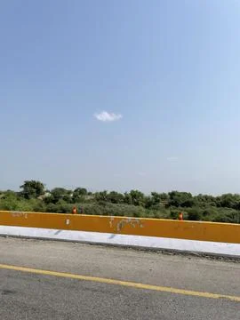 The Yellow Barrier and the Single Cloud Stock Photos