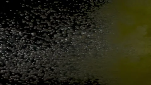 Yellow Bath Bomb Dissolving in Water With Bubbles and Hue Stock Footage 274846703