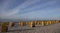 Yellow beach chairs at low tide North Sea mudflats golden hour sunset 4k or 4k+ Resolution
