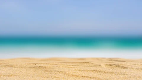 Yellow beach sand of texture on blue sea background. Stock Footage 114070130