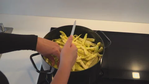 Yellow beans cooked in black pot on stove Stock Footage 145726059
