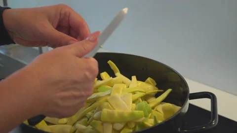 Yellow beans cooked in black pot on stove Stock Footage 145726580