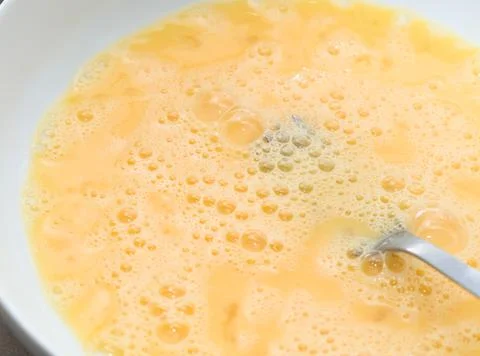 Yellow Beaten Eggs Stock Photos